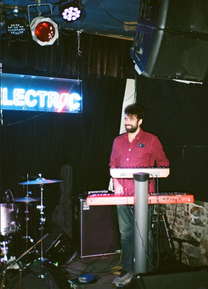 Max playing keyboards on stage